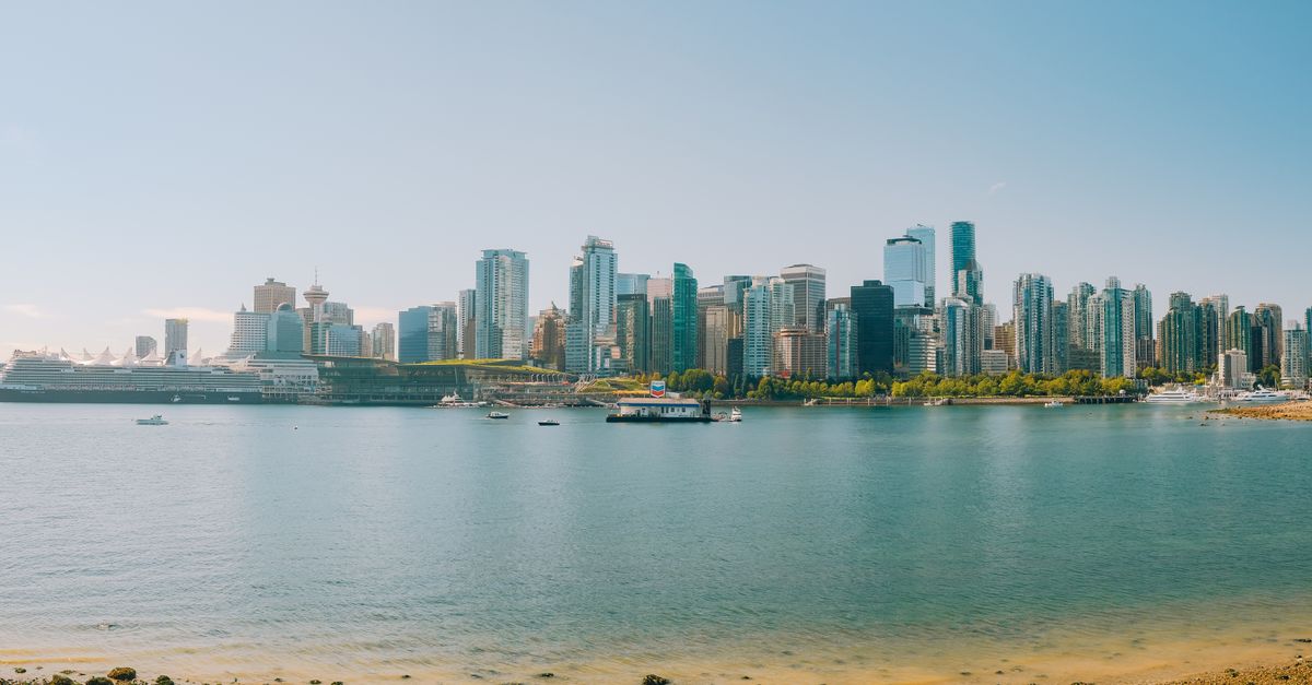 Explore the stunning Vancouver skyline with a picturesque waterfront. Perfect for travel and cityscape enthusiasts.